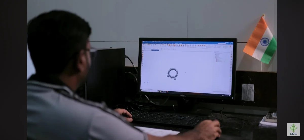 PTPL programmer preparing machining data at a CAD workstation